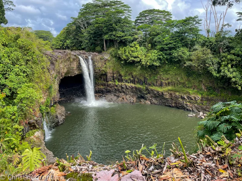 Rainbow Falls with morning mist and lush tropical vegetation in Hilo Hawaii — a key stop on the Green Travel and Tour volcano day trip