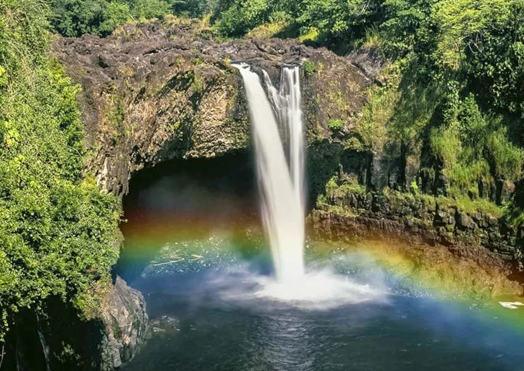 Tour van at Rainbow Falls Hilo Hawaii on a full-day volcano and waterfall tour of the Big Island