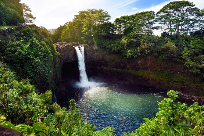 Group at Punaluʻu black sand beach on a half-day volcano and waterfall tour from Hilo Hawaii Big Island